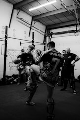 a group of people standing around a gym