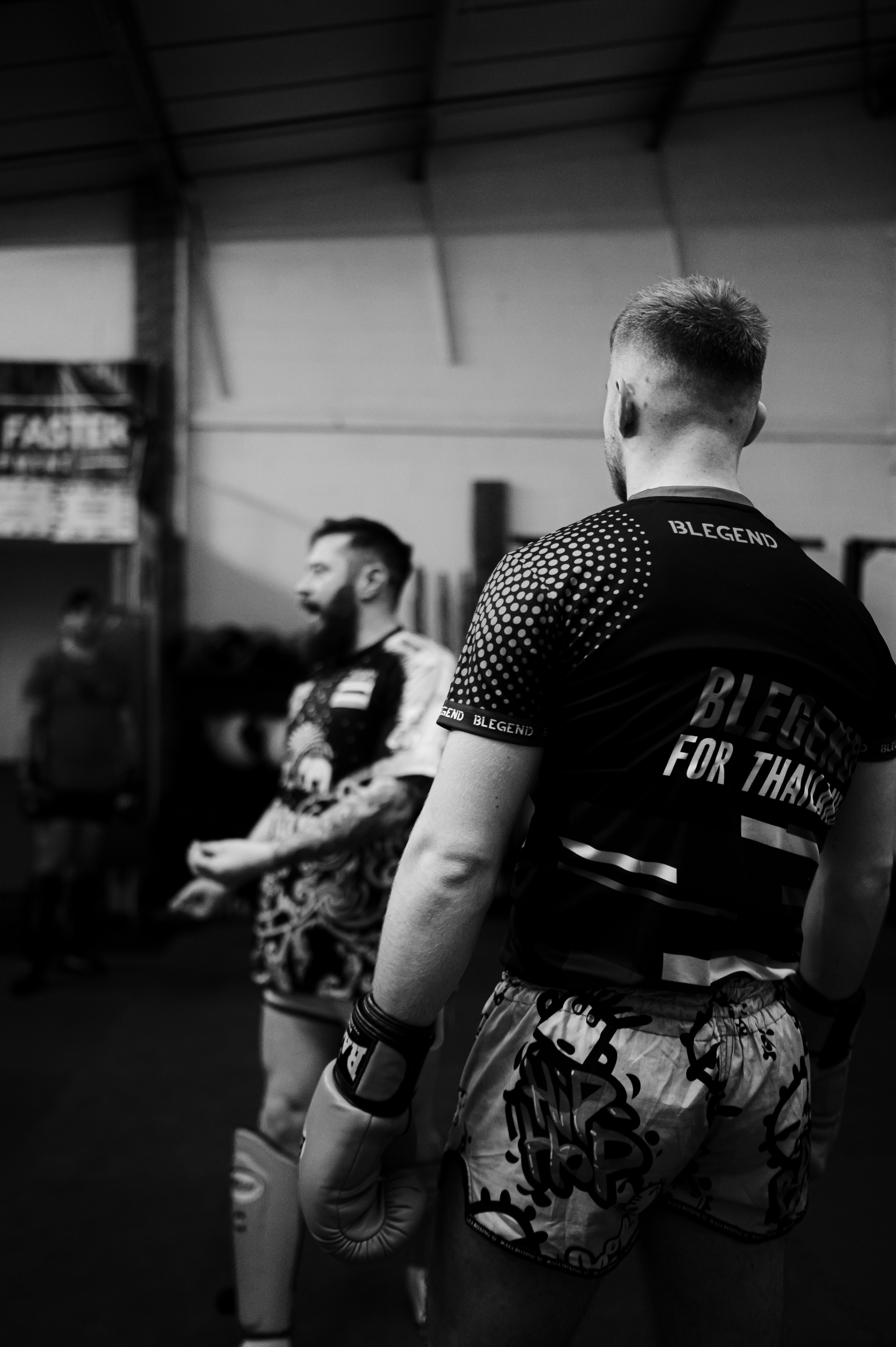 a couple of men standing next to each other