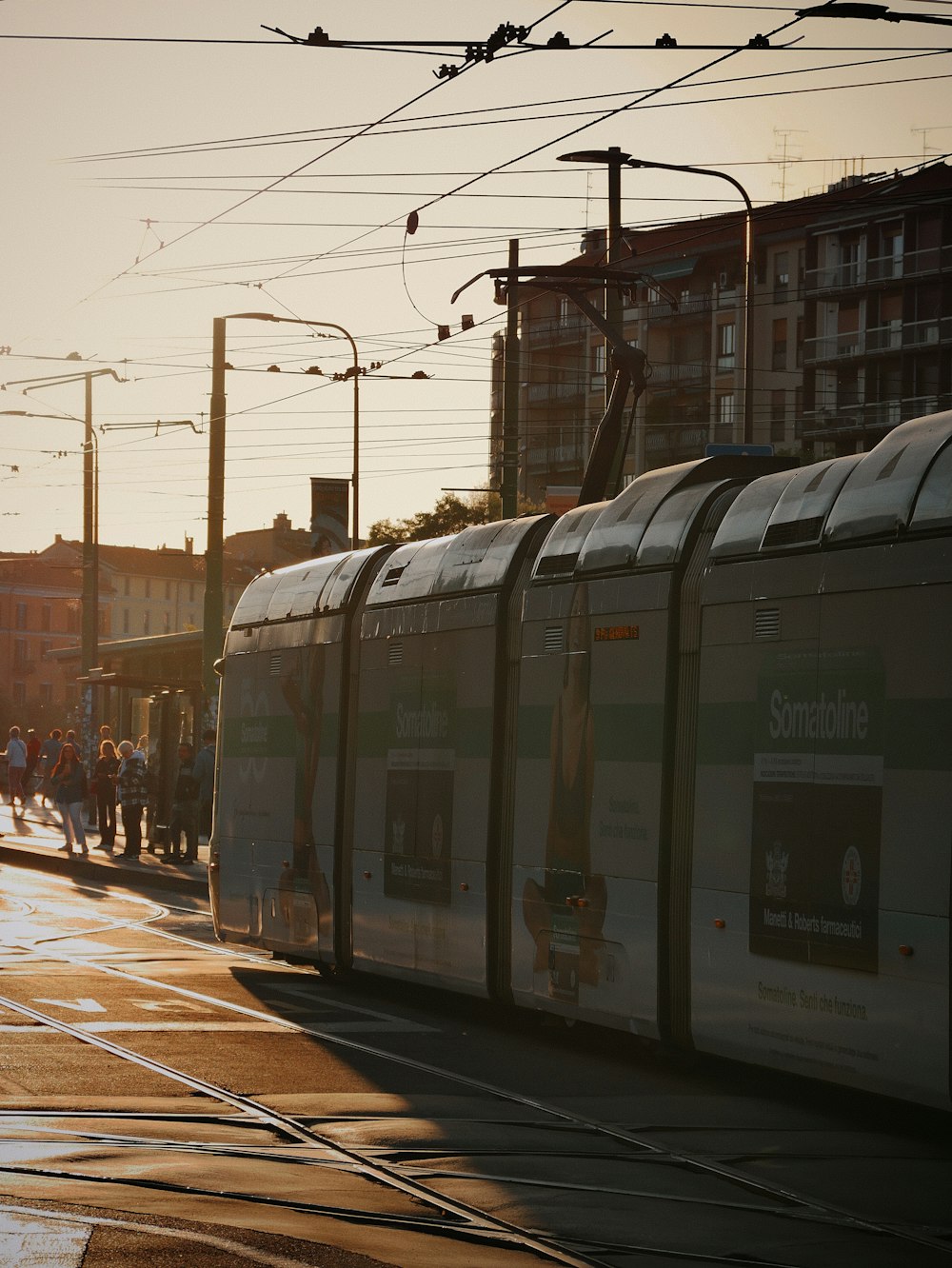 a city street with a train on the tracks