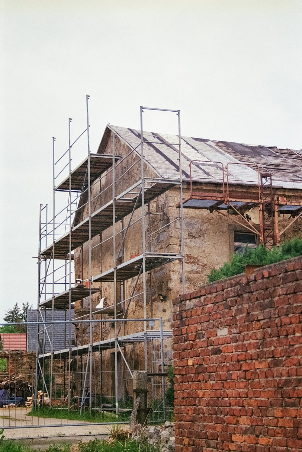 a brick building with scaffolding around it