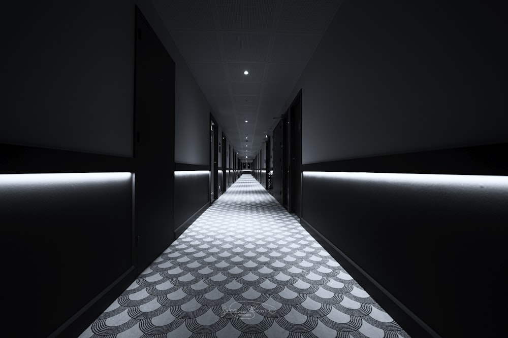 a long hallway with lights on either side of it