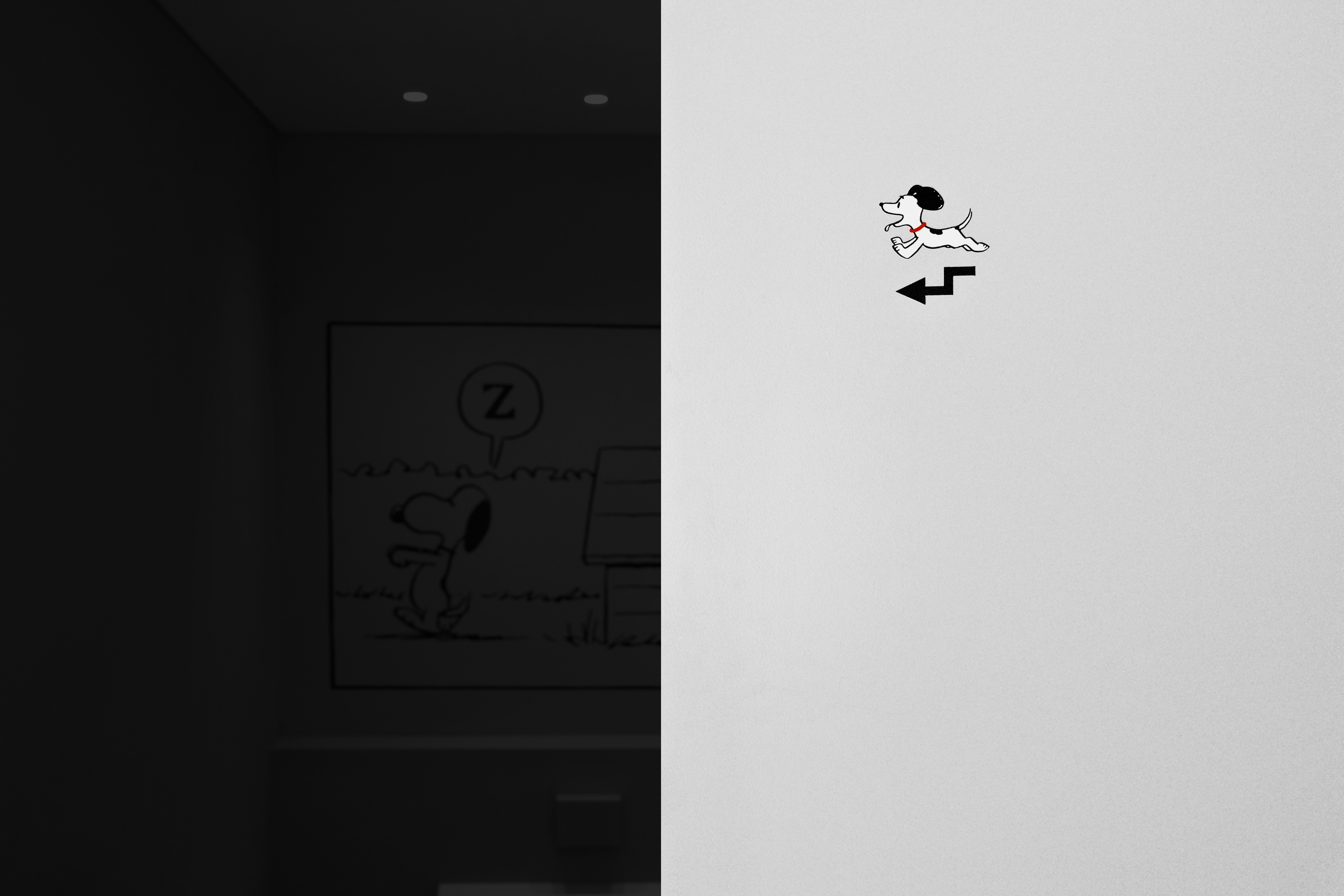 a black and white photo of a door with a sticker on it