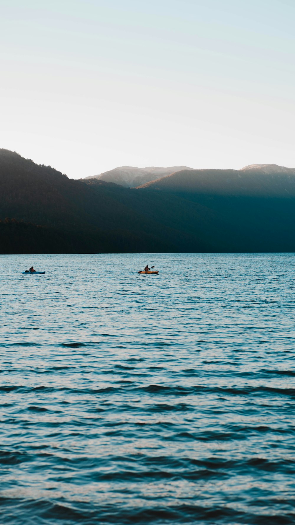 a body of water with some people in it