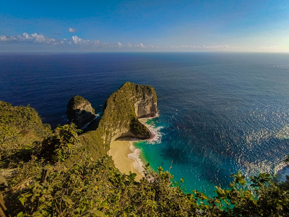 a view of the ocean from the top of a hill