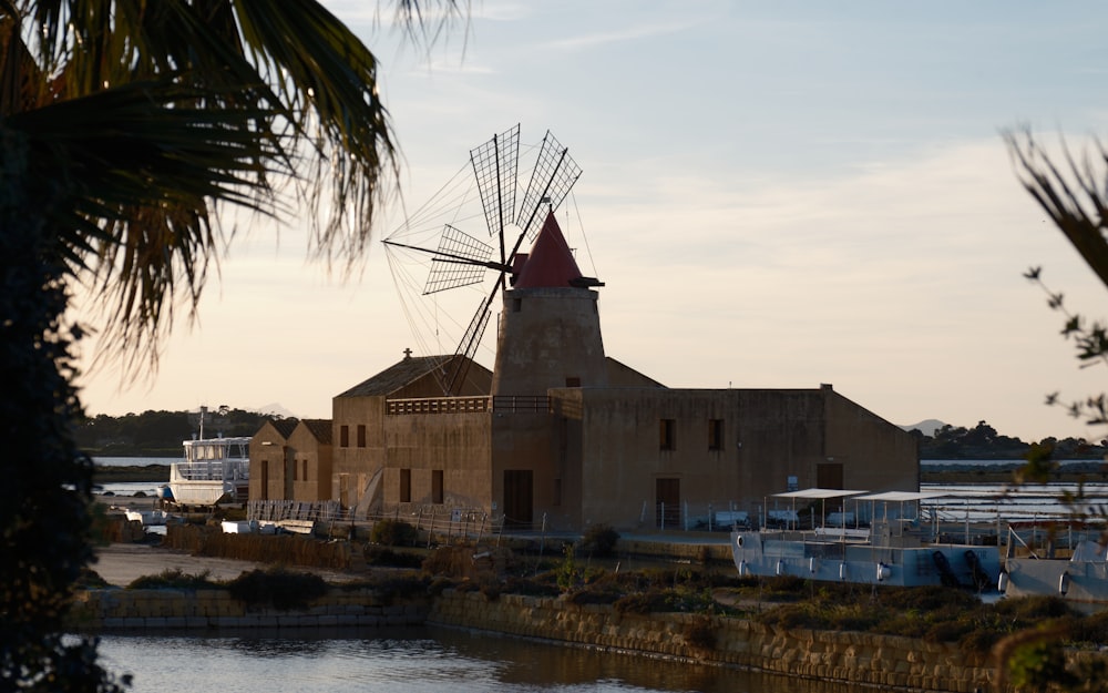 an old building with a windmill on top of it