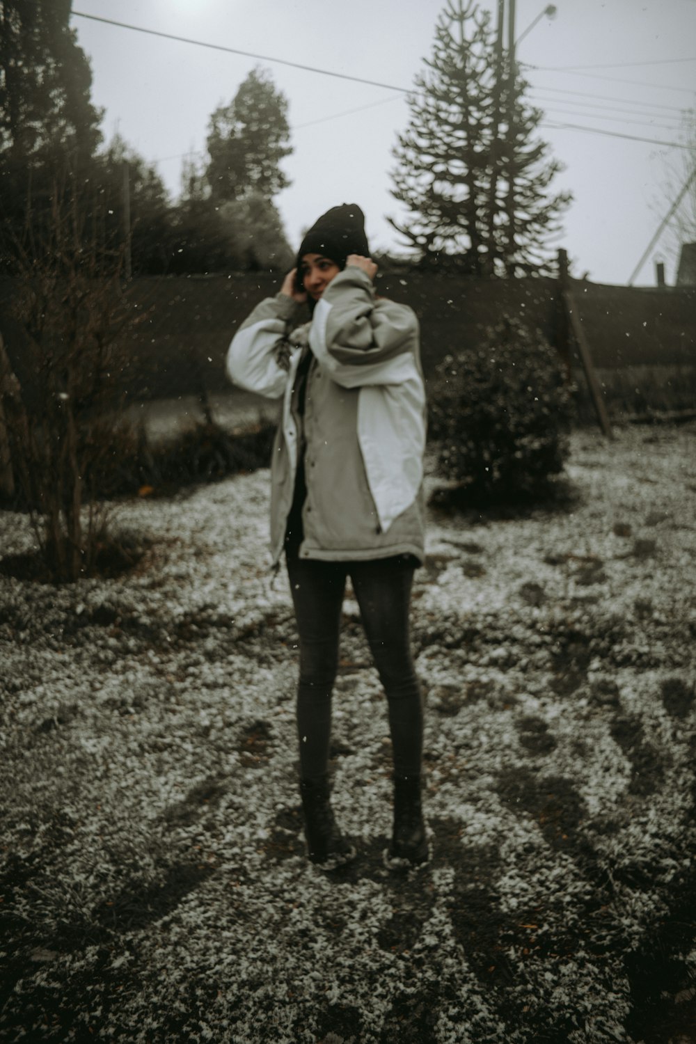 a person standing in a field covered in snow