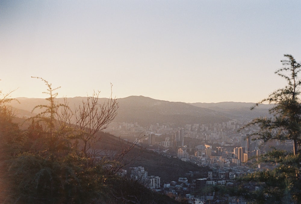 a view of a city with mountains in the background