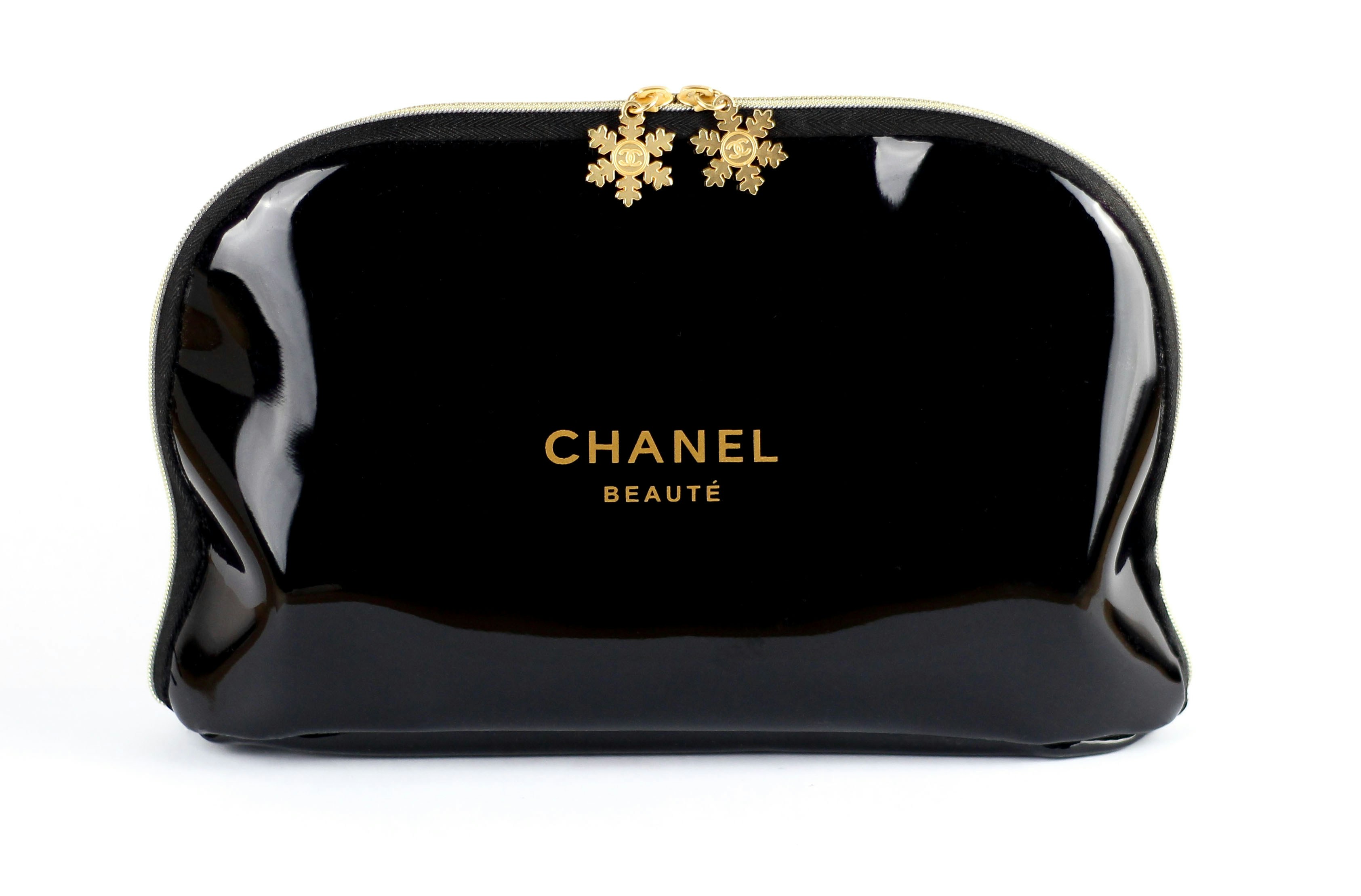 a black purse with a gold clasp on it