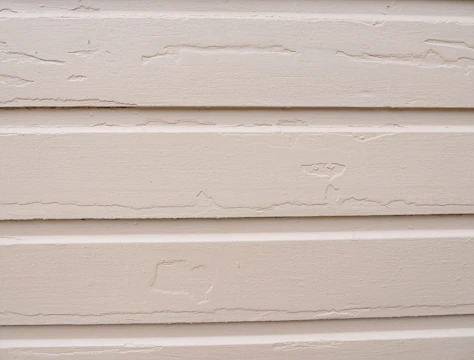 New siding panels being installed on a residential home in Queens.