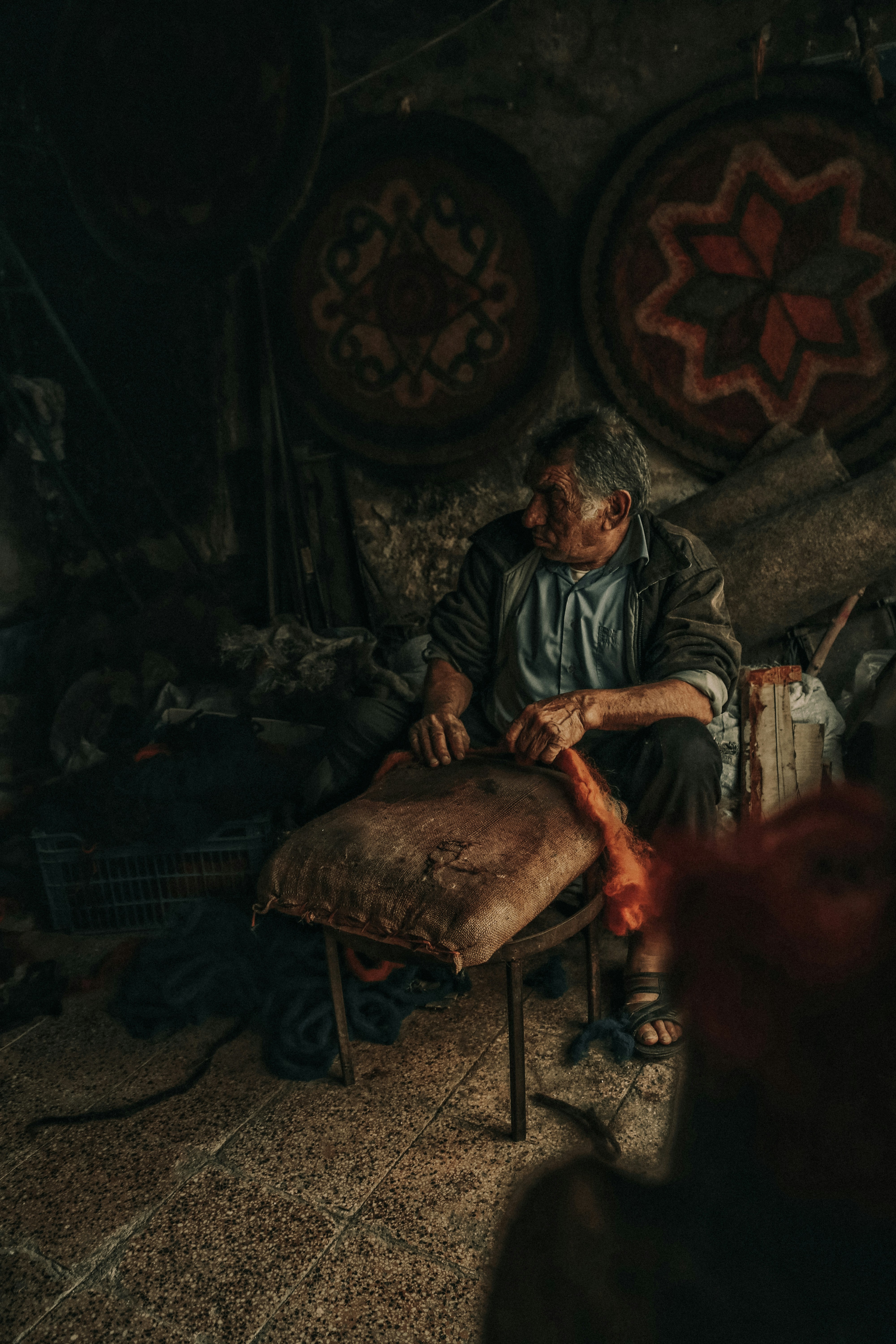 a man sitting on a chair in a room