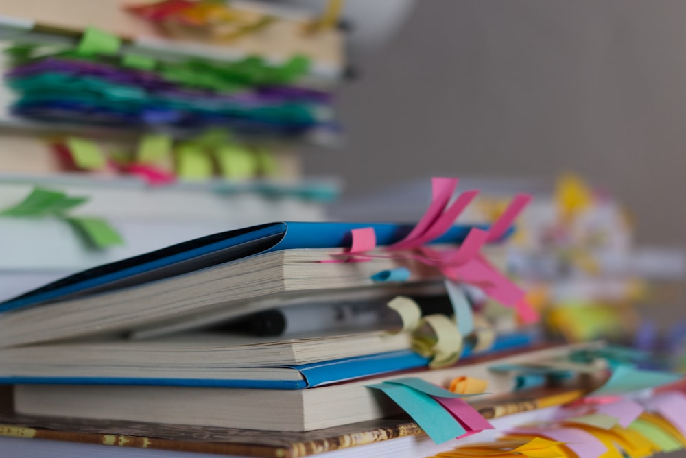 a stack of books sitting on top of a table