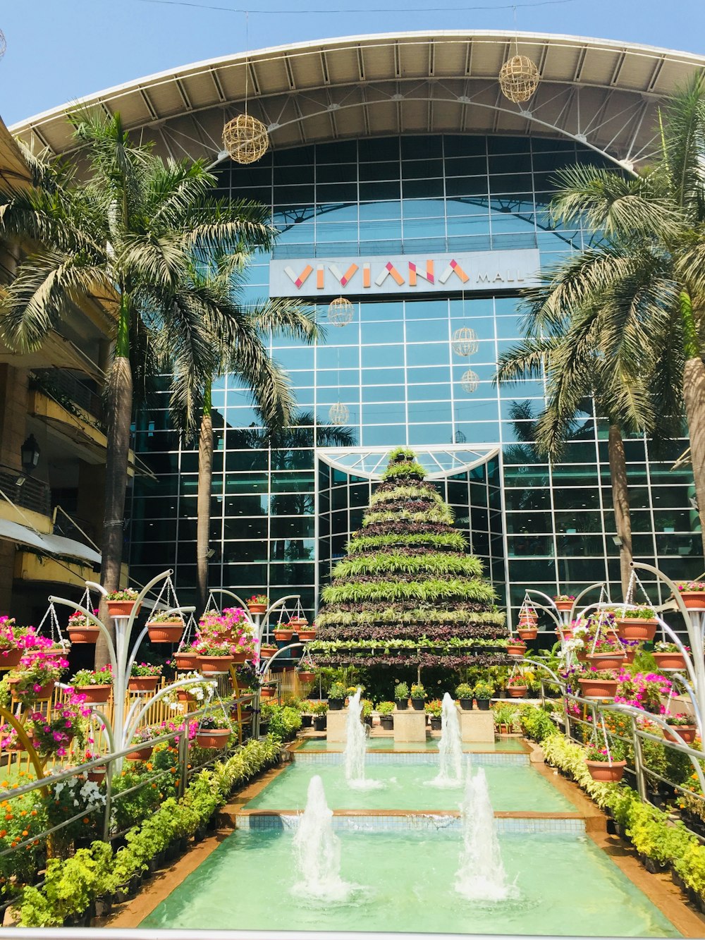 a large building with a fountain in front of it