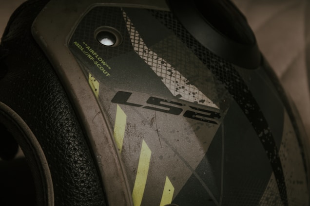 A detailed focus on a motorcycle helmet with the brand logo 