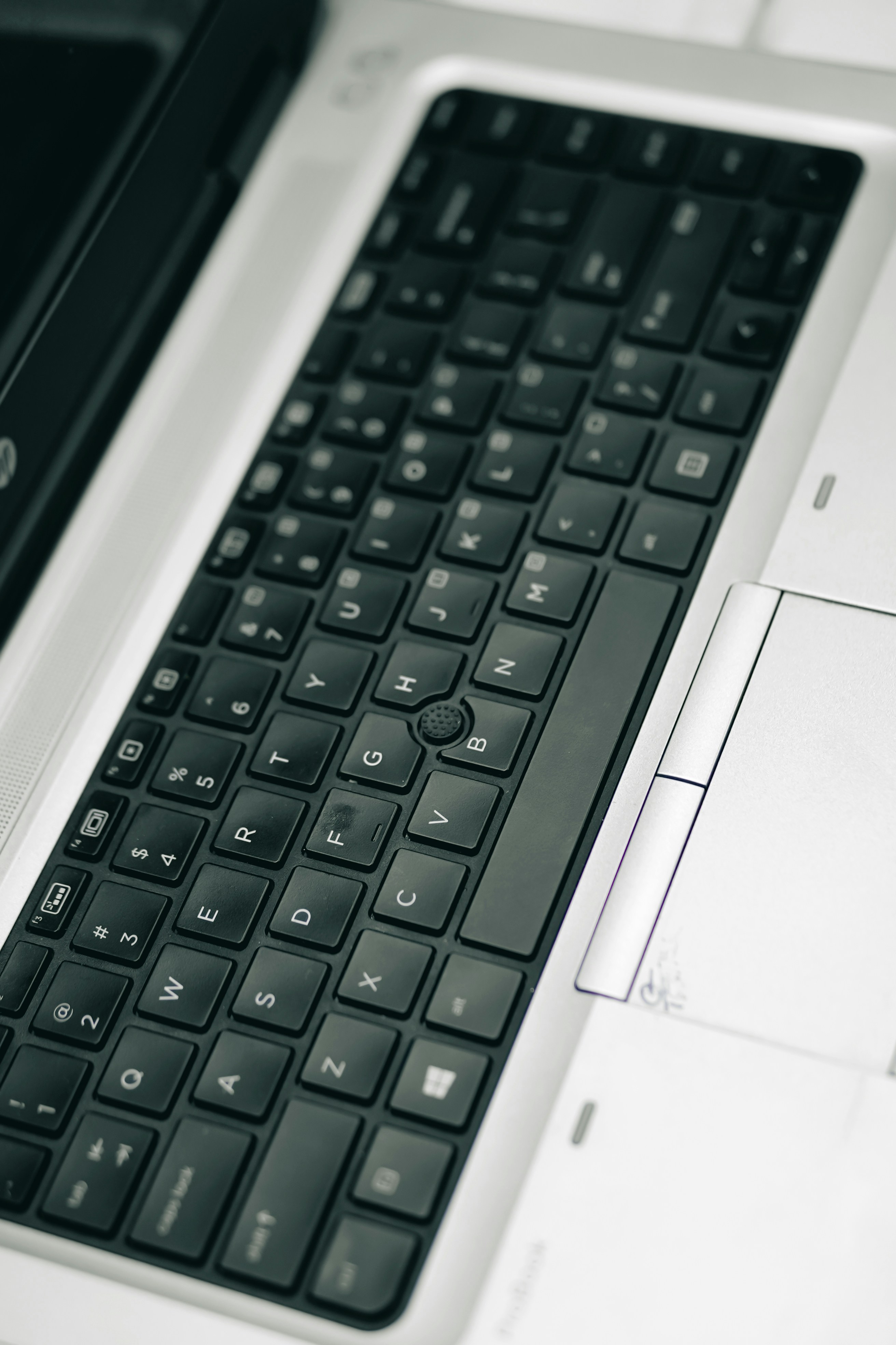 a black and white photo of a laptop keyboard