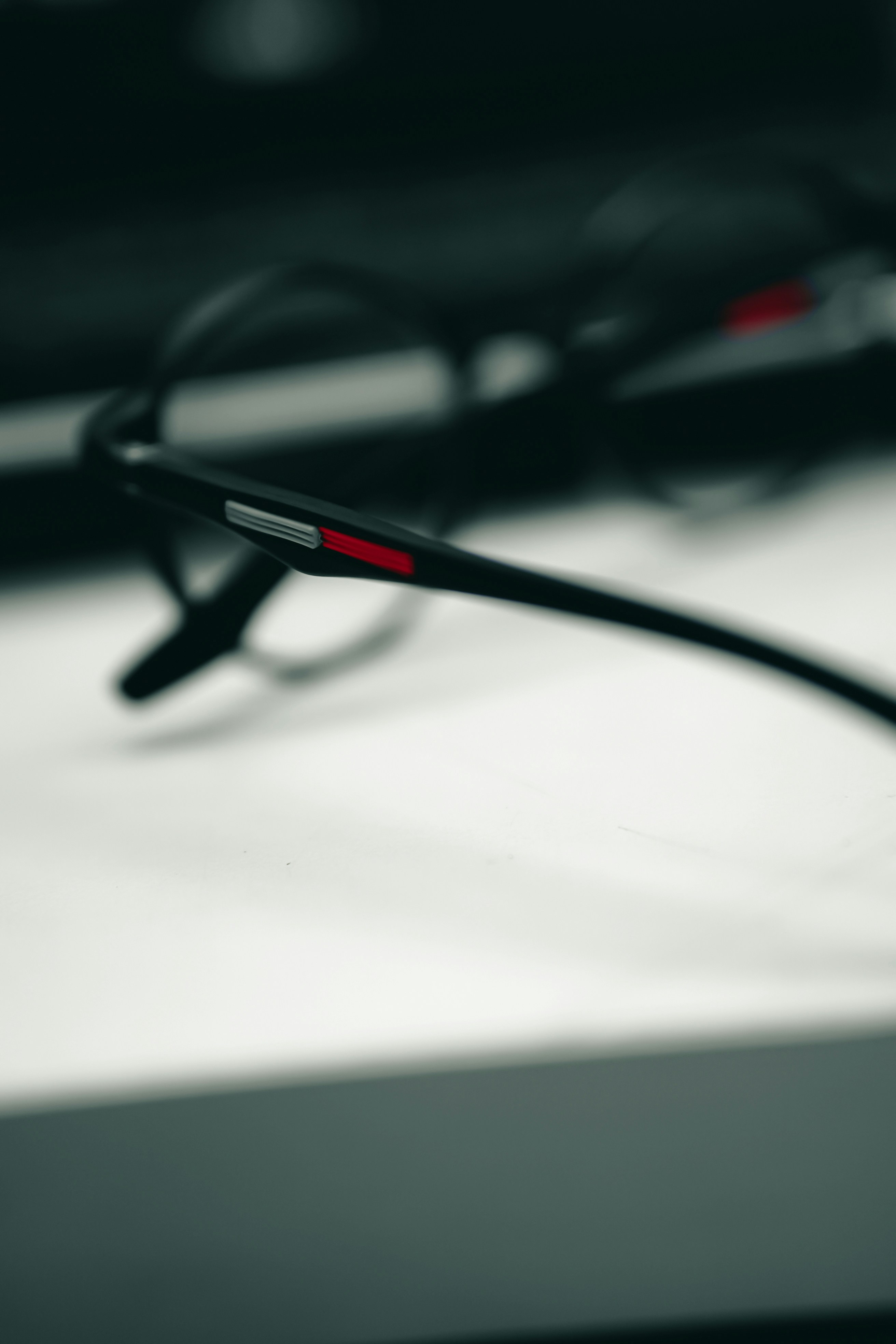 a pair of glasses sitting on top of a table