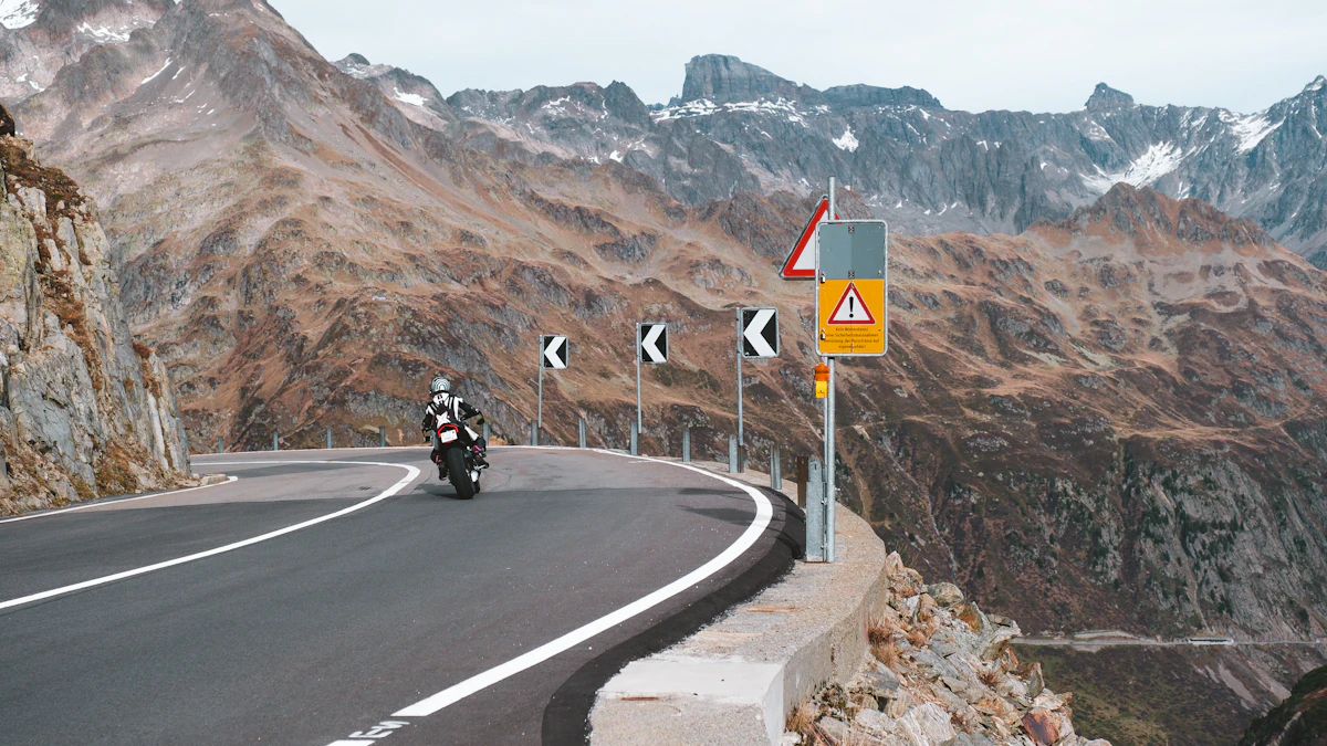 A motorcyclist riding a winding mountain road