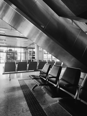 a black and white photo of a waiting area
