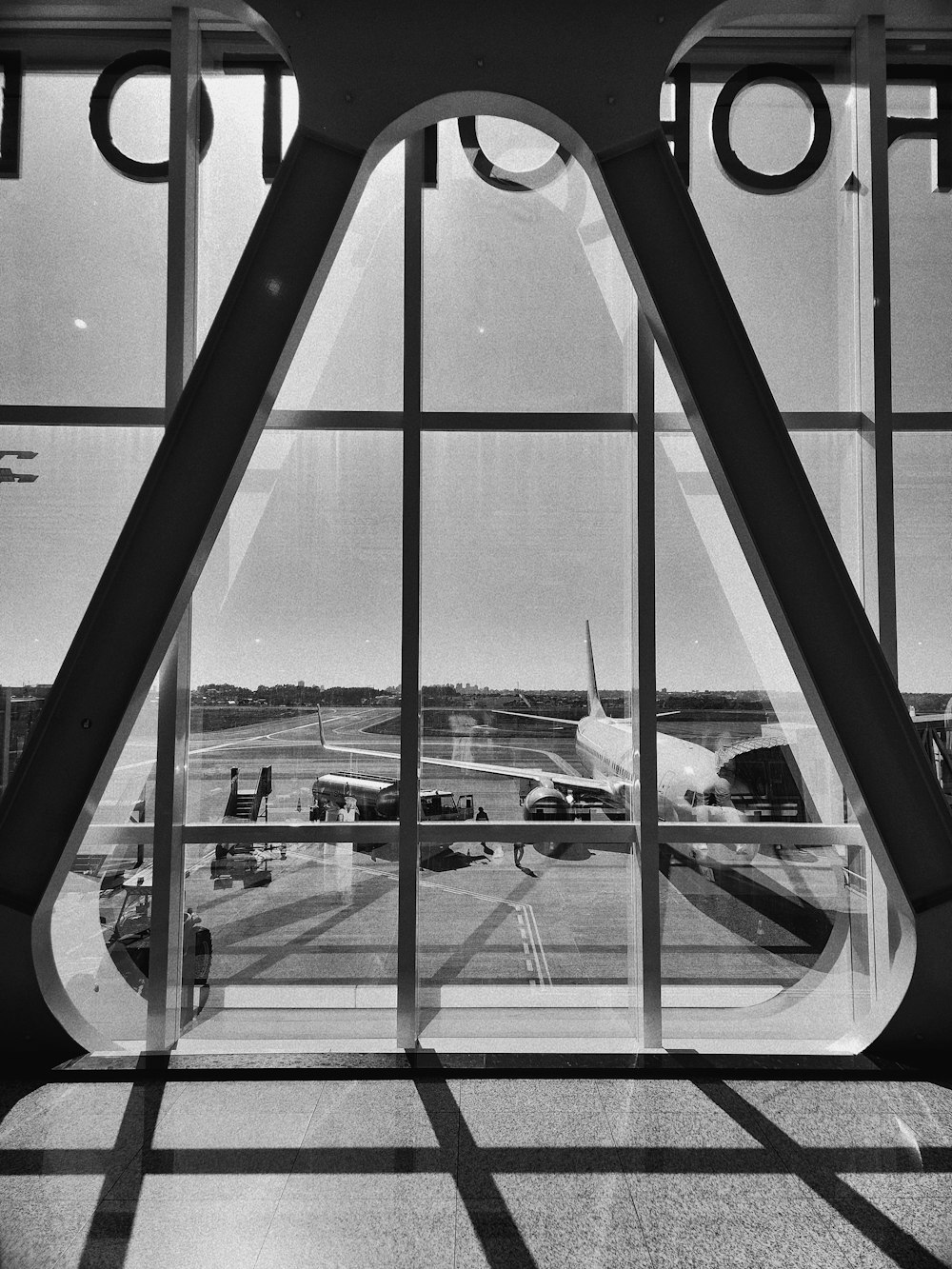 a black and white photo of an airport
