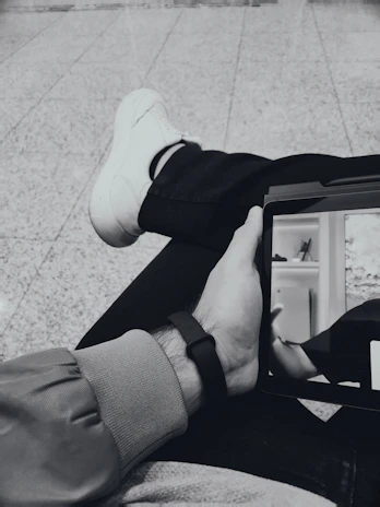 Neutral silhouette of a person interacting with a digital learning interface.