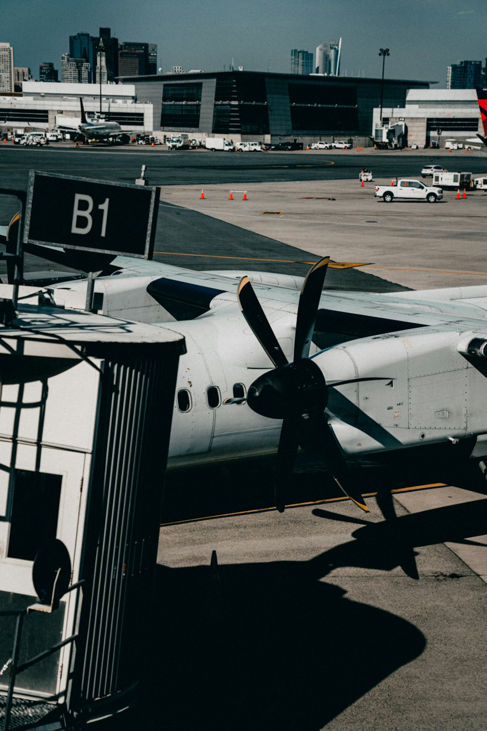 a small propeller plane parked at an airport