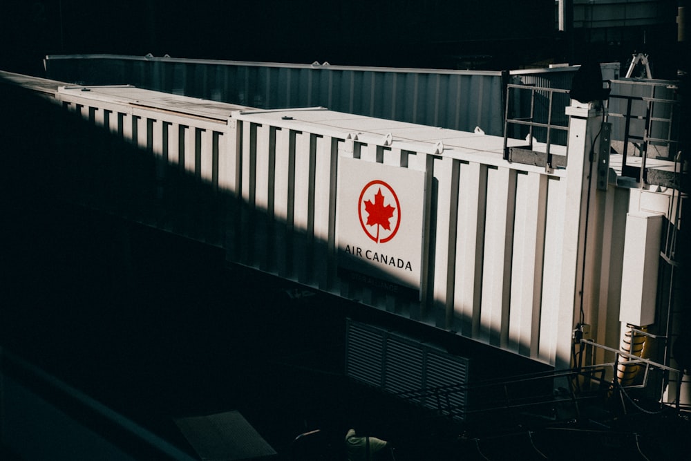 a train traveling down train tracks next to a building