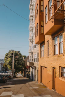 Sunlit street view highlighting multiple infill lots available for redevelopment.