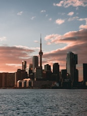 a large body of water with a city in the background
