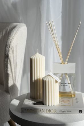 A softly lit room with aromatic fragrance cards subtly placed on a sleek office desk.