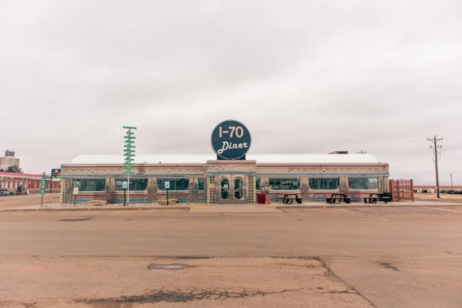 A scenic roadside diner stop with the fire truck parked out front during a sunny day.