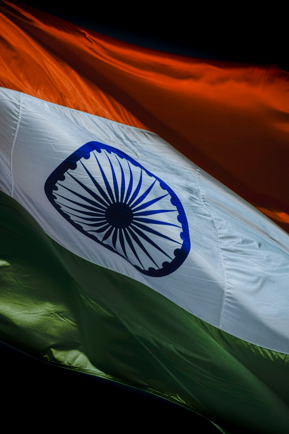 the indian flag is flying in the wind