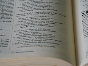 Soft candlelight flickering beside an open hymnal with psalm verses