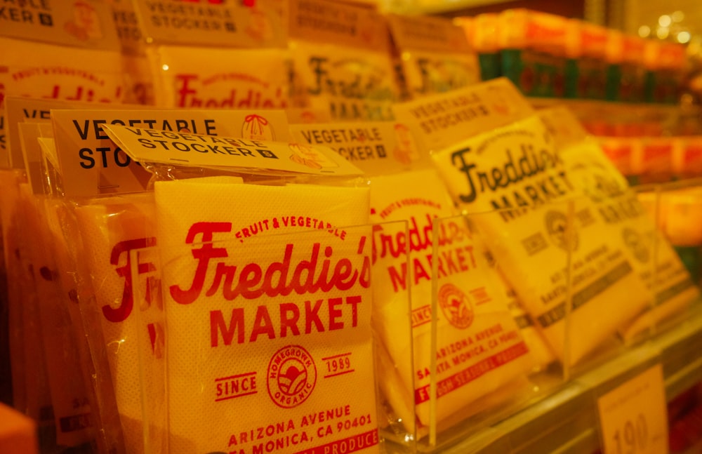 a display case filled with lots of different types of cheese