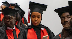 a group of people in graduation caps and gowns