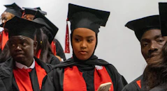 a group of people in graduation caps and gowns