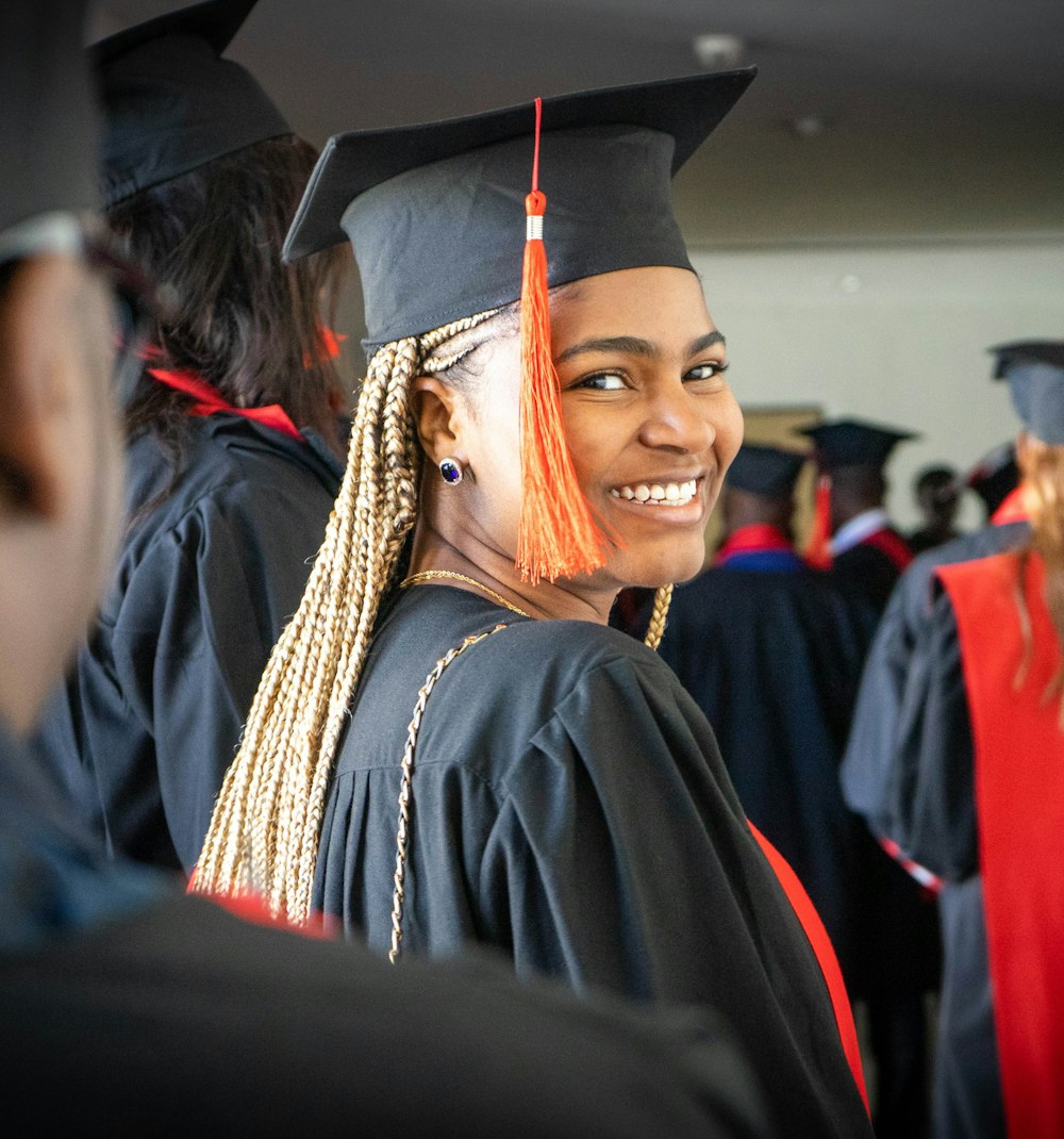 a woman in a graduation cap and gown