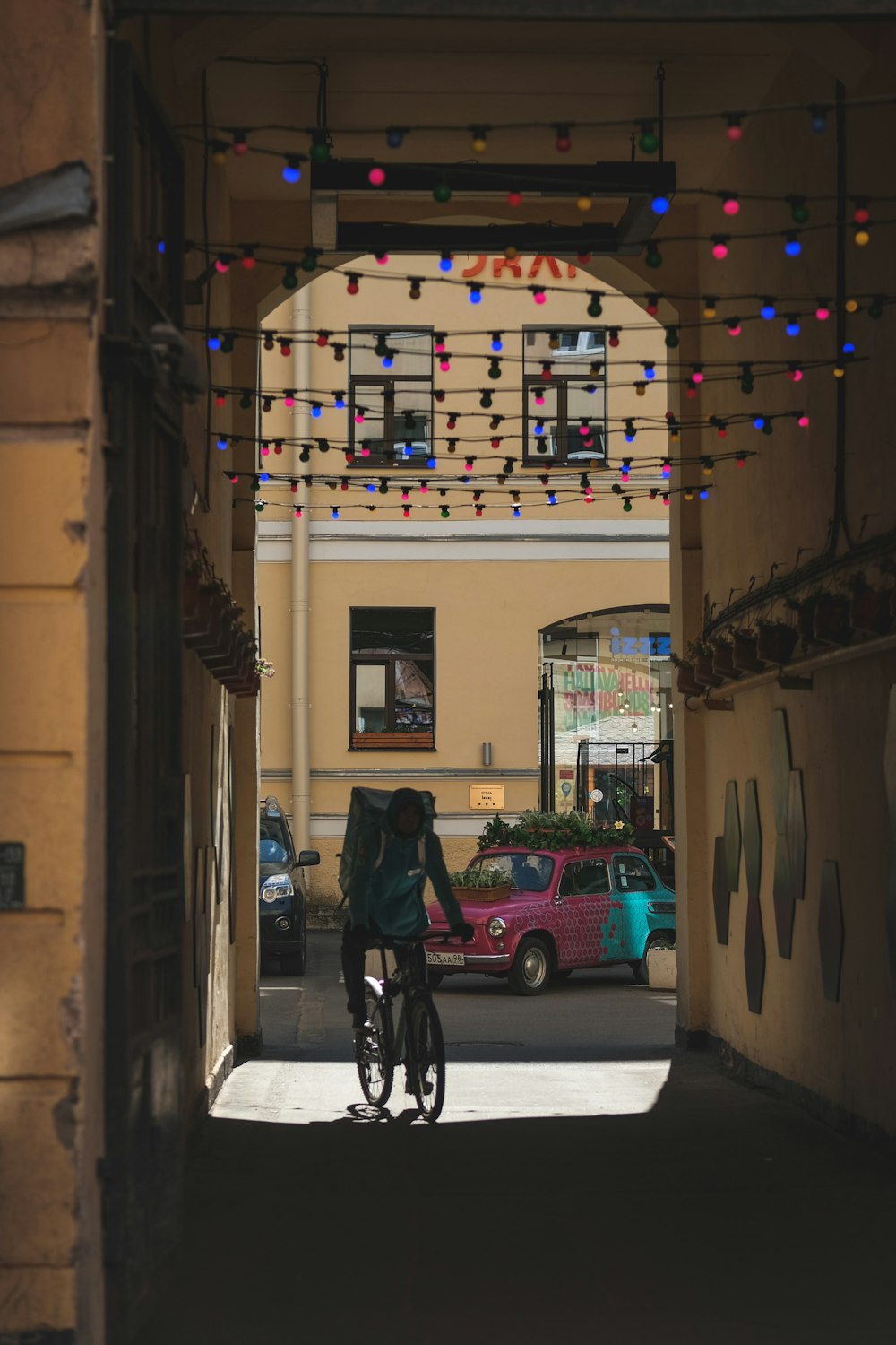 a person riding a bike down a street