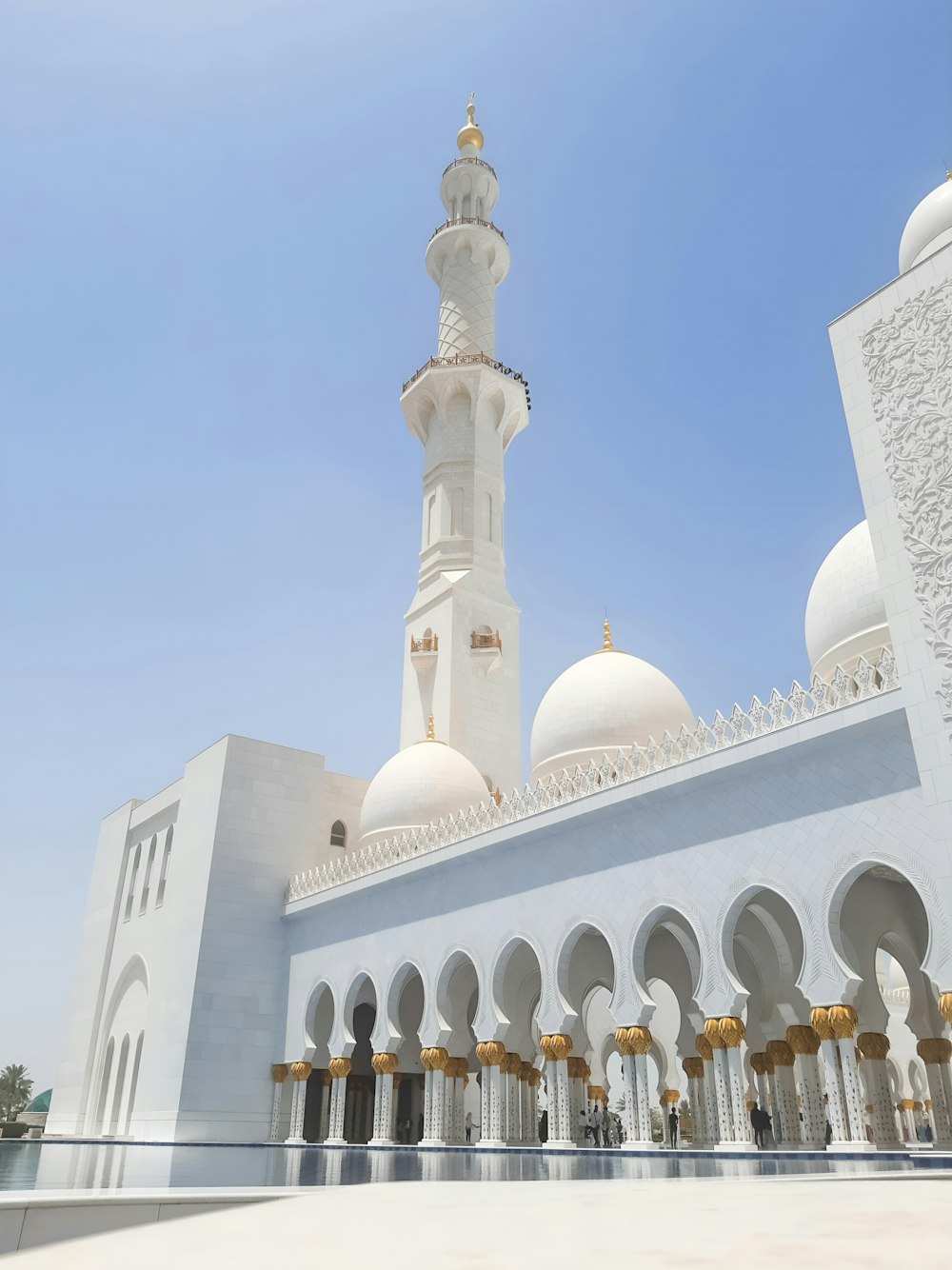 a large white building with a tall white tower