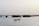 a small boat floating on top of a body of water