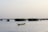 a small boat floating on top of a body of water