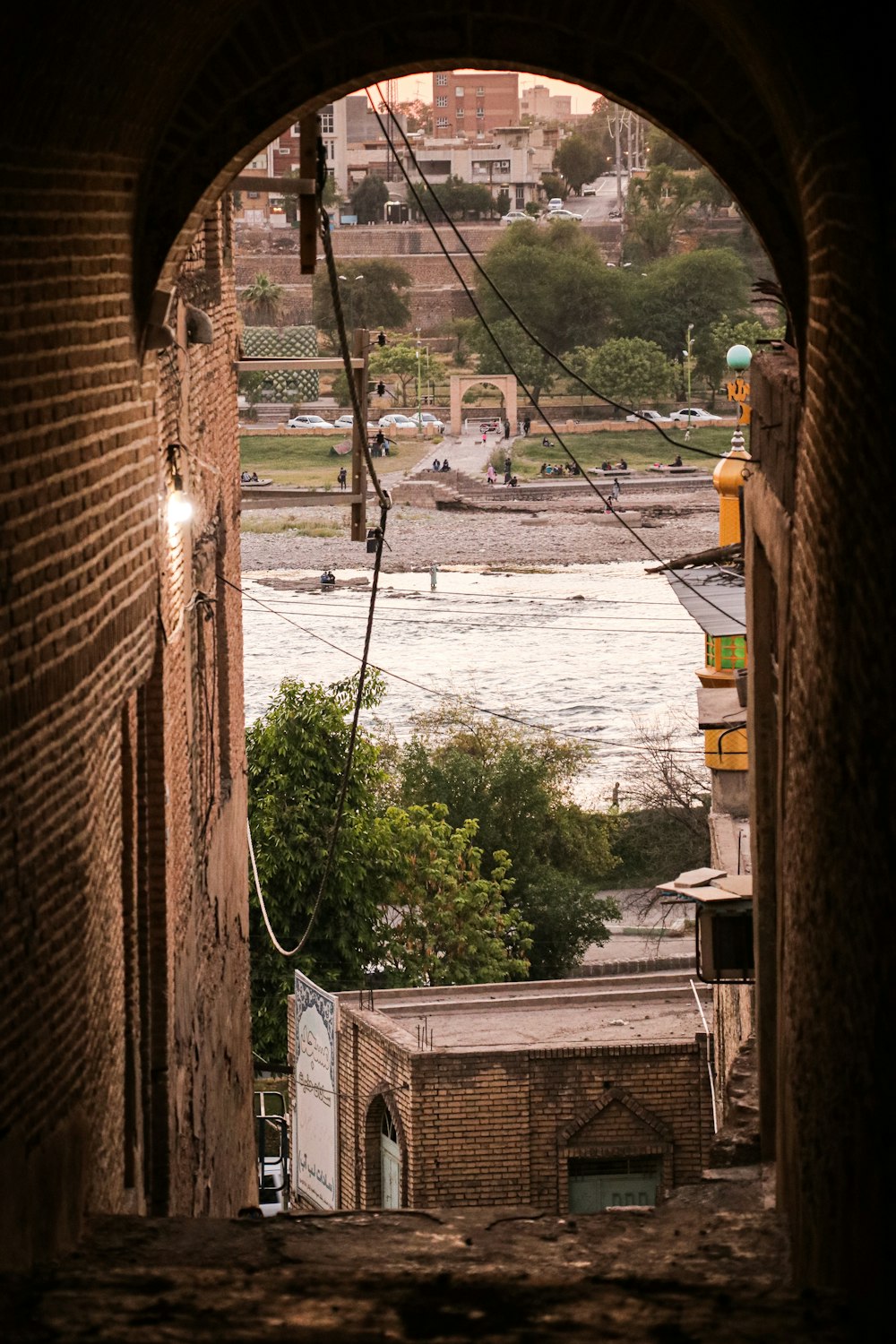 a view of a body of water through an archway