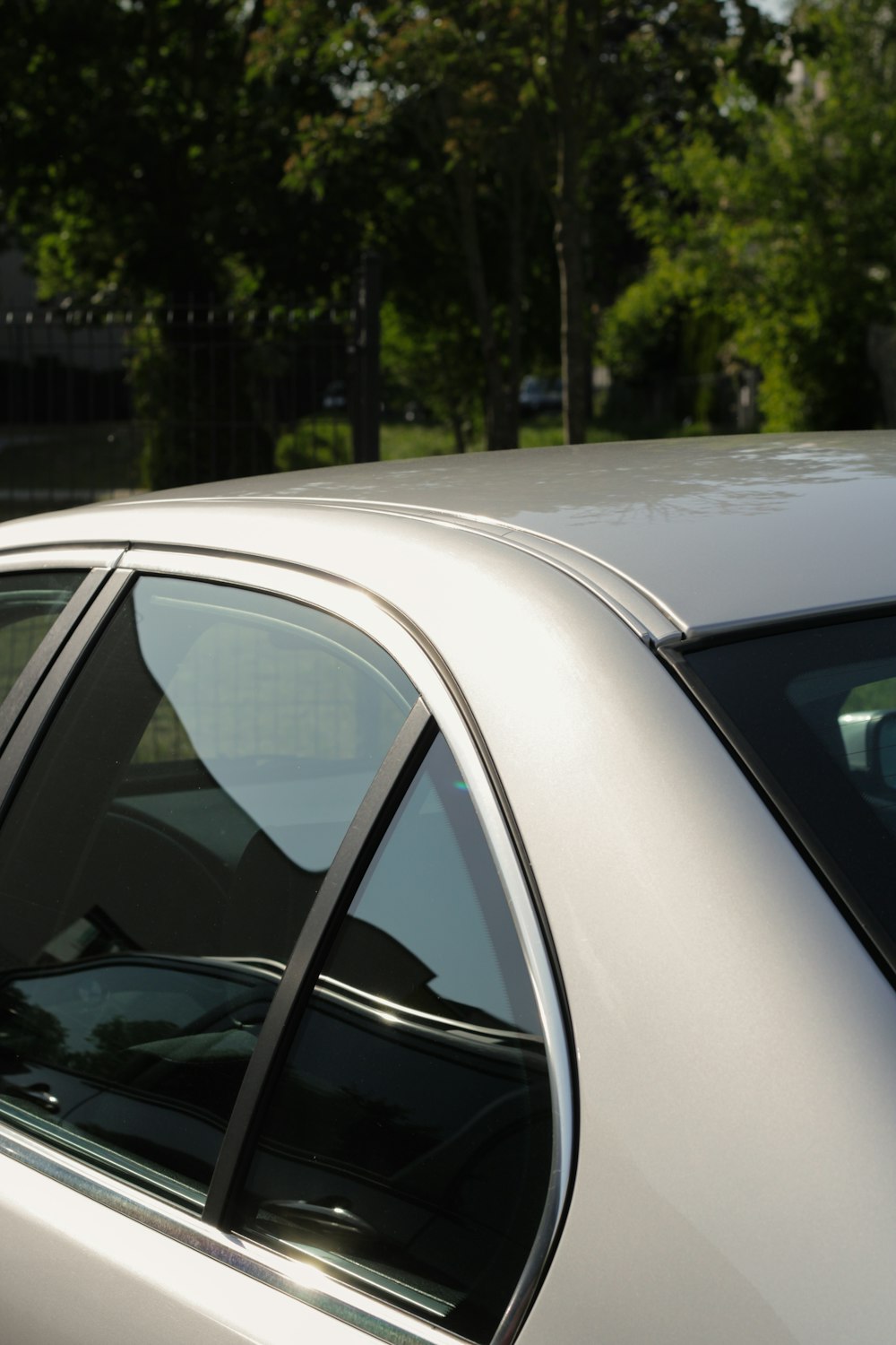 a close up of a car with trees in the background