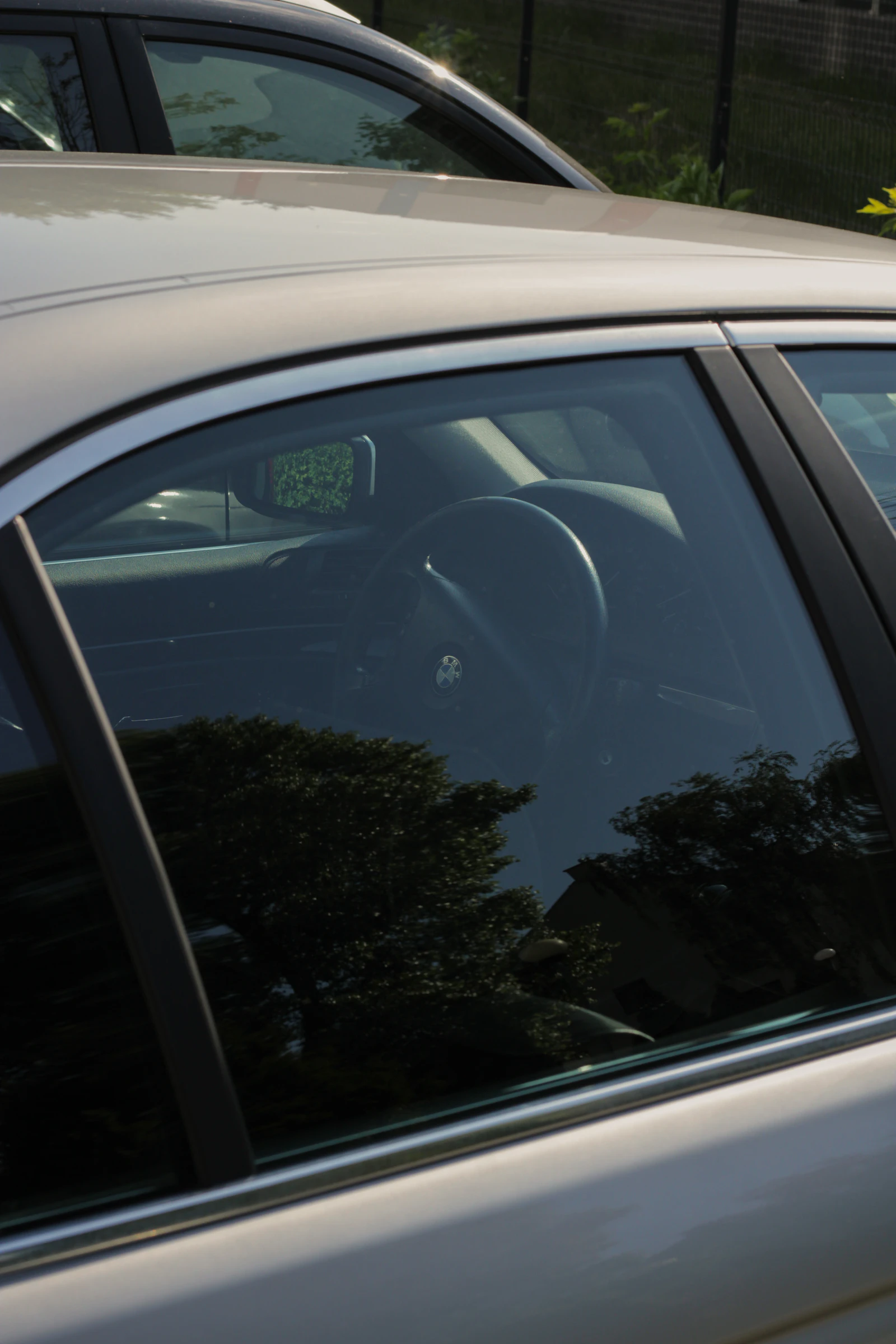 Close up of a car window with tint film applied