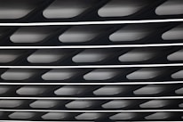 Close-up of decorative gypsum ceiling installation in a commercial office.