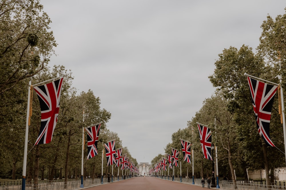 a street lined with lots of flags on both sides of it