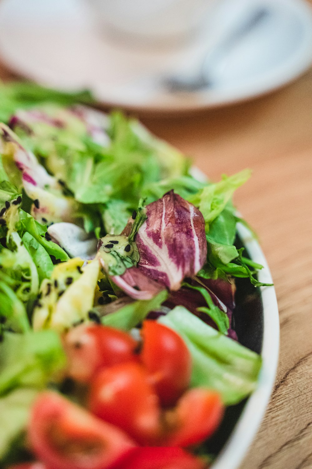 a close up of a plate of salad on a table