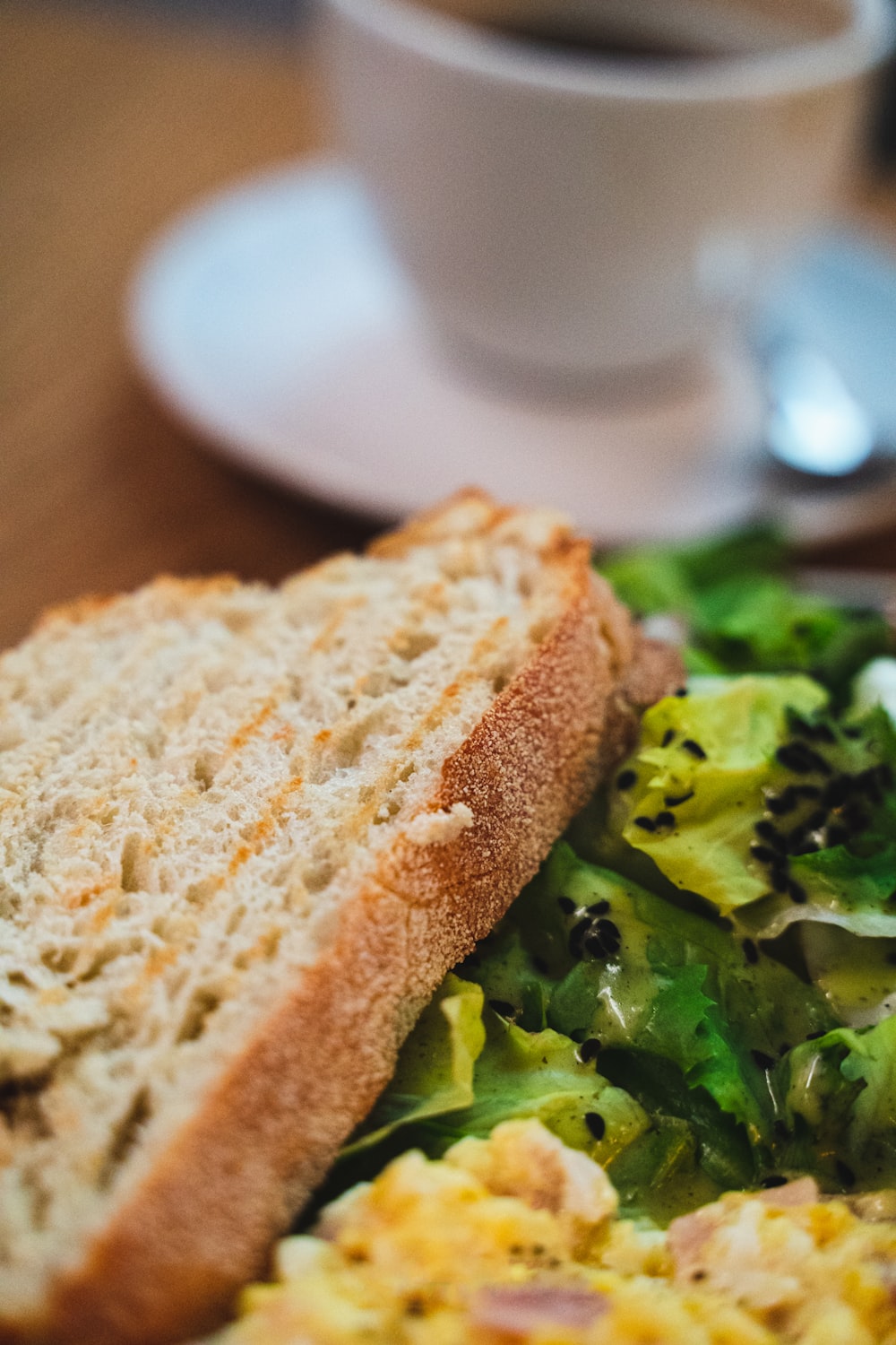 a close up of a plate of food with a sandwich