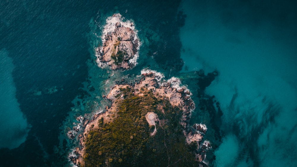 an aerial view of an island in the middle of the ocean