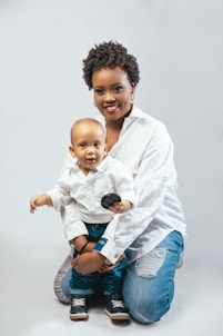 a woman holding a baby in her lap