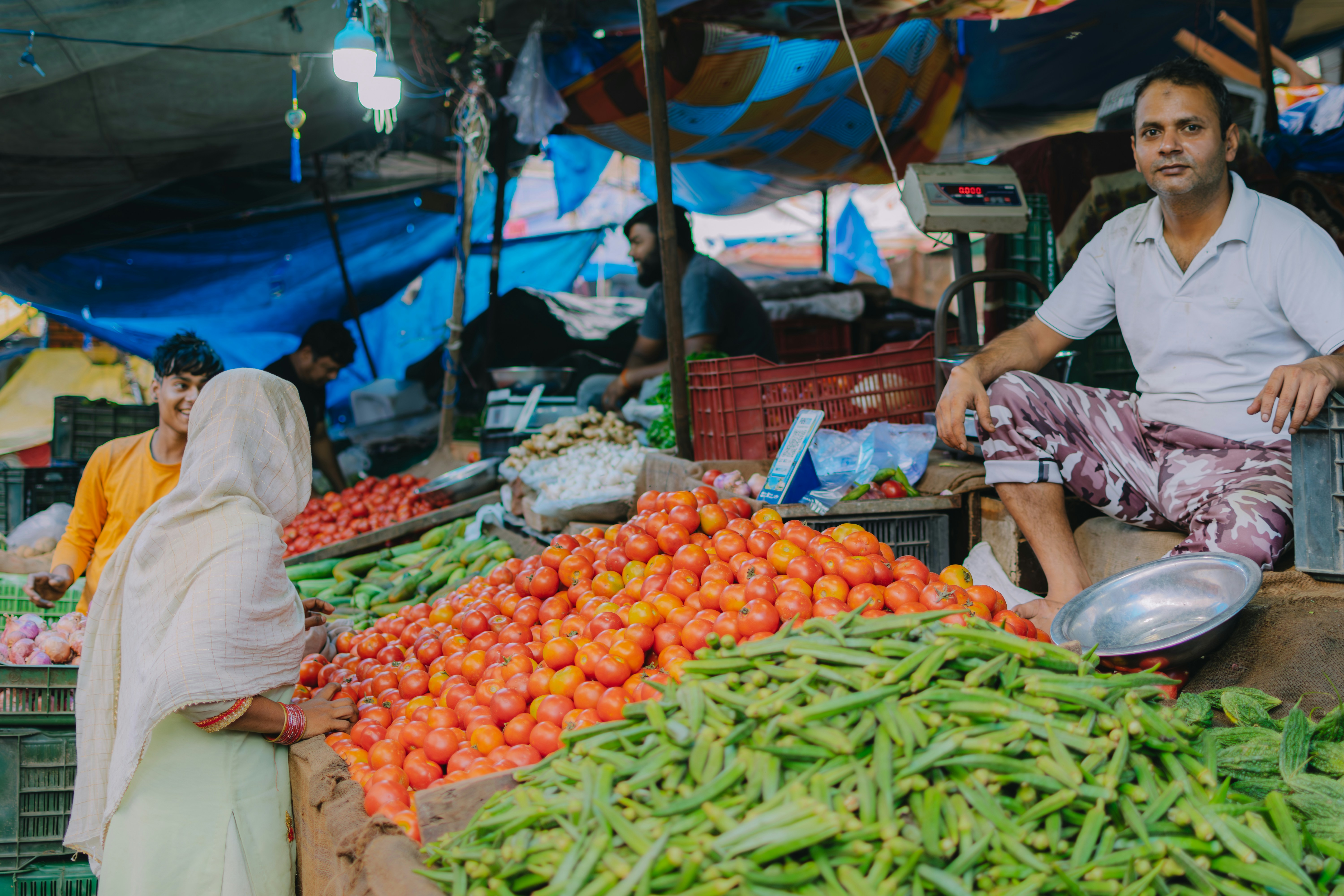 Farmers at vegetable stand