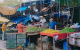 Marketplace scene showing farmers selling produce at mandi.